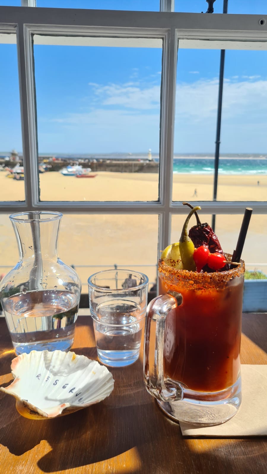 A table looking out towards St Ives Harbour